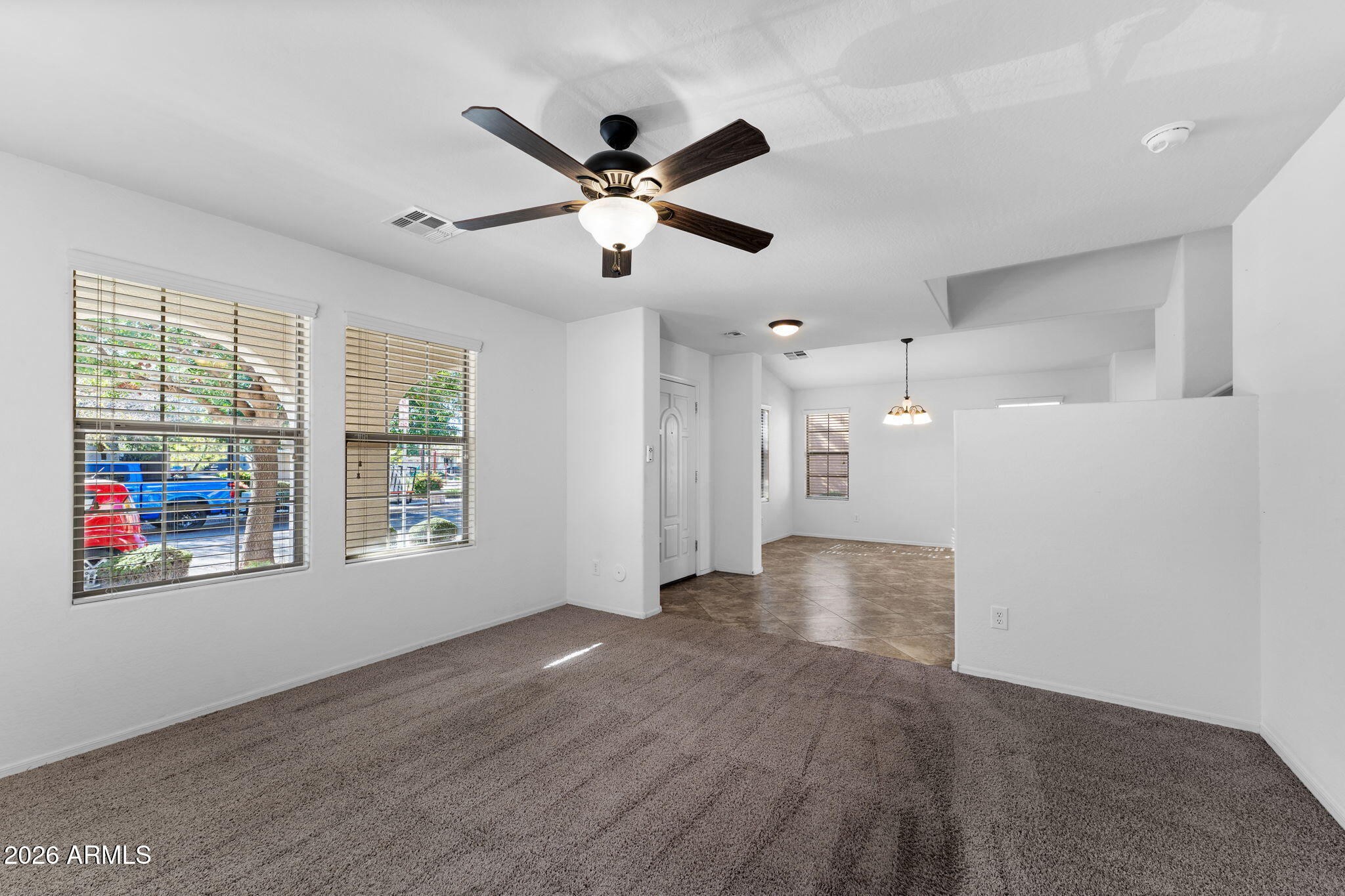 3500 East Milky Way Gilbert, AZ 85295 - Photo 5 of 23 a view of an empty room with a window and wooden floor