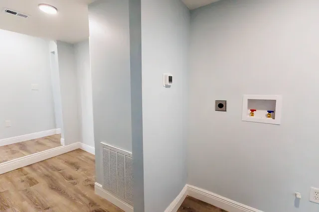 a view of small space with wooden floor