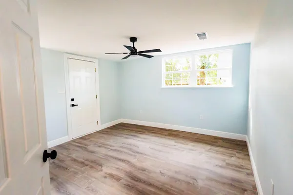 a view of an empty room with a window