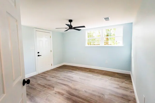 a view of an empty room with a window