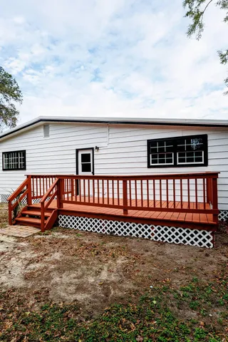 a front view of a house with a wooden fence