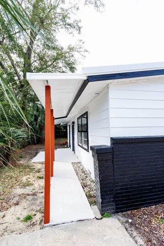 a view of a house with a tree