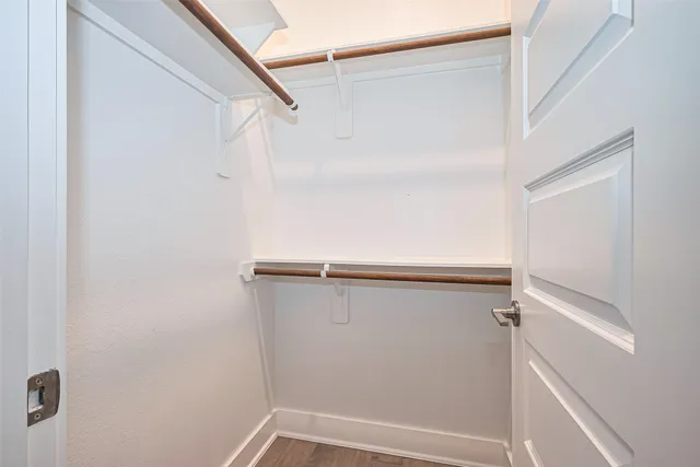 a view of an empty walk in closet