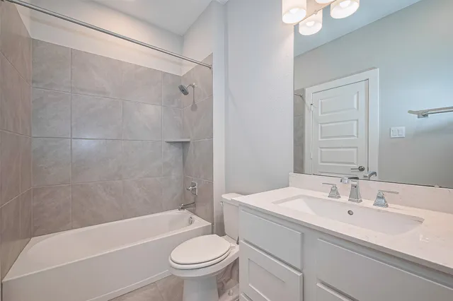 a bathroom with a sink a toilet and a bathtub