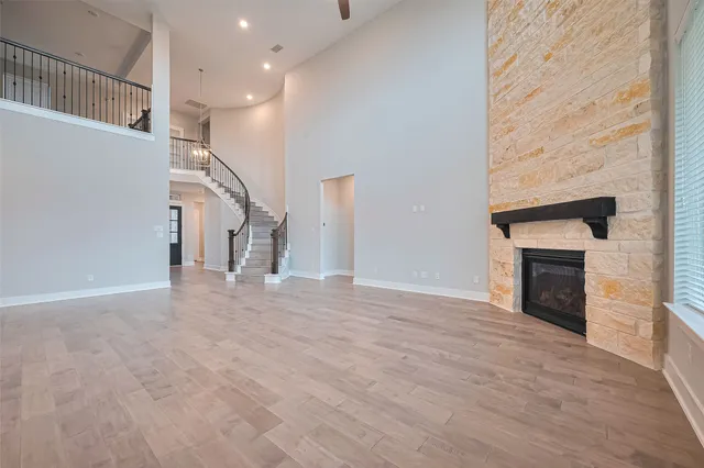 a view of a livingroom with an empty space and a fireplace