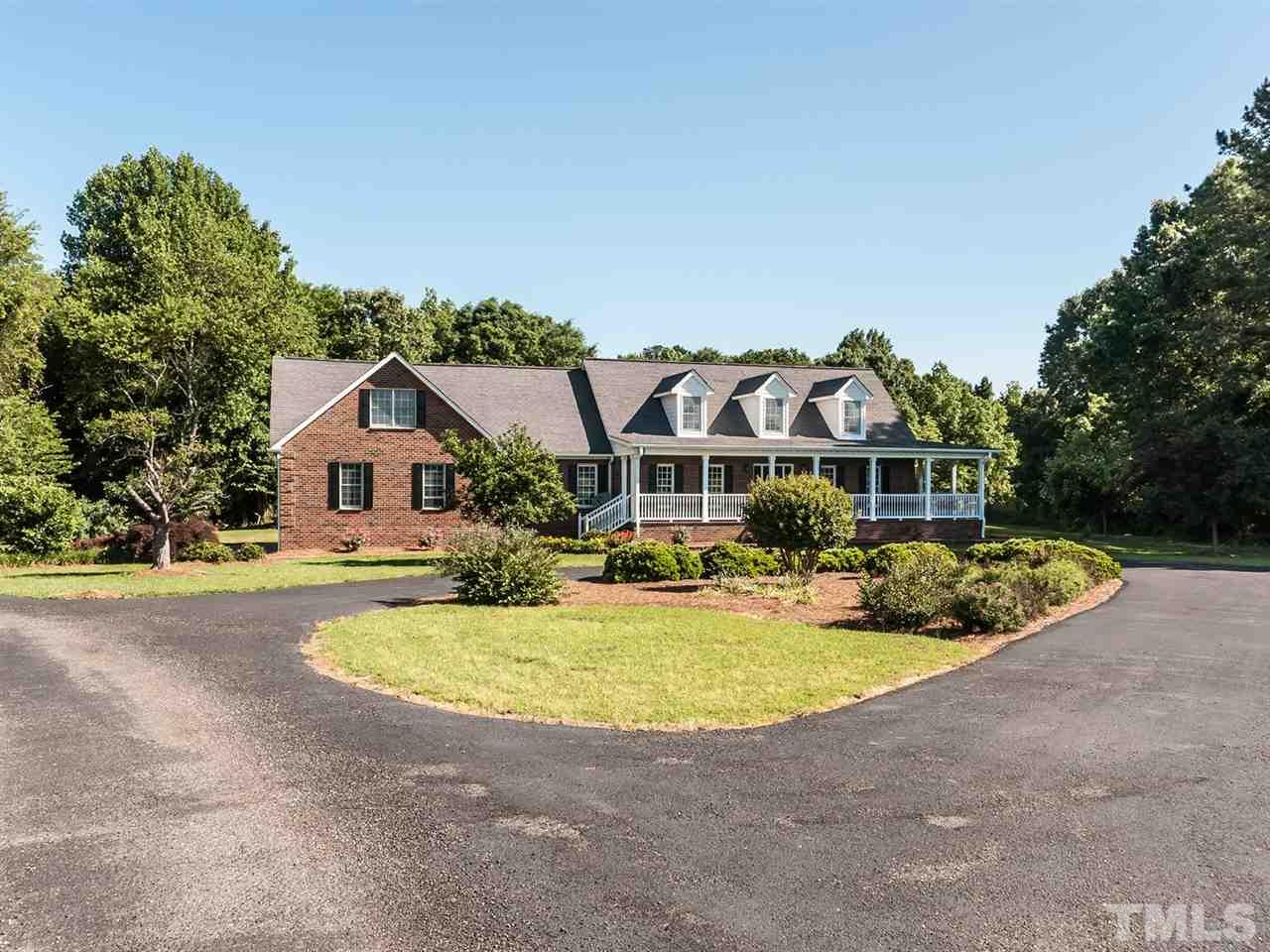 3128 Sanders Road Willow Spring, NC 27592 - Photo 1 of 25 a front view of house with outdoor space and swimming pool