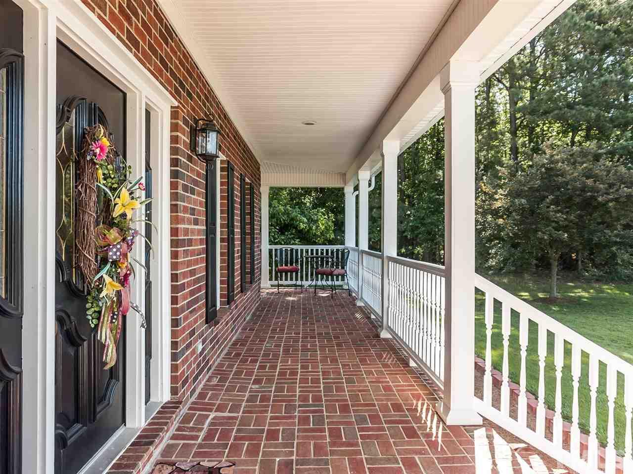 3128 Sanders Road Willow Spring, NC 27592 - Photo 2 of 25 a view of a balcony with door