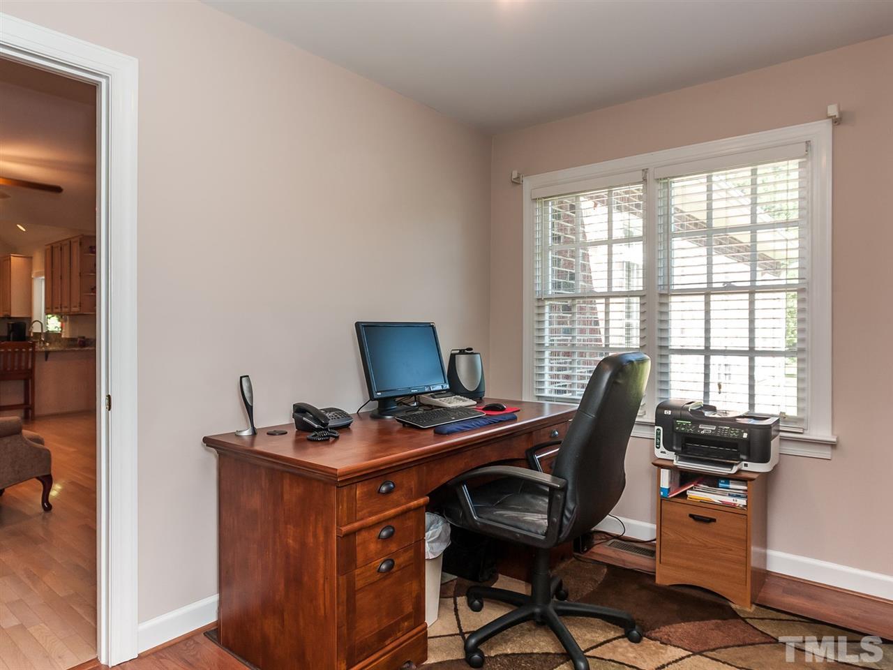 3128 Sanders Road Willow Spring, NC 27592 - Photo 10 of 25 a view of a workspace with furniture and a window