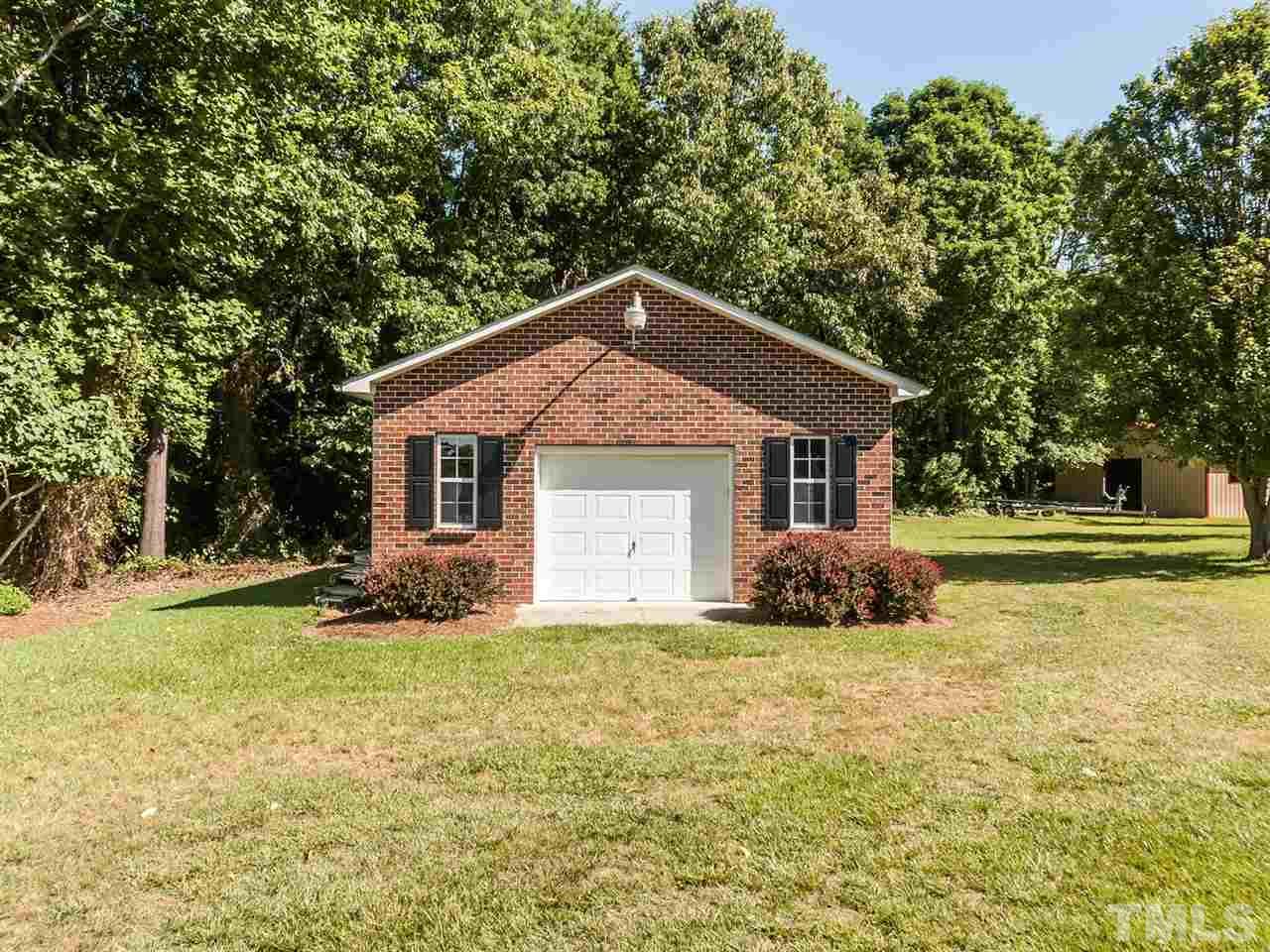 3128 Sanders Road Willow Spring, NC 27592 - Photo 15 of 25 a front view of house with yard and green space
