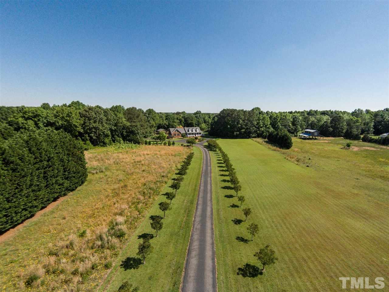 3128 Sanders Road Willow Spring, NC 27592 - Photo 20 of 25 a view of a swimming pool and a yard