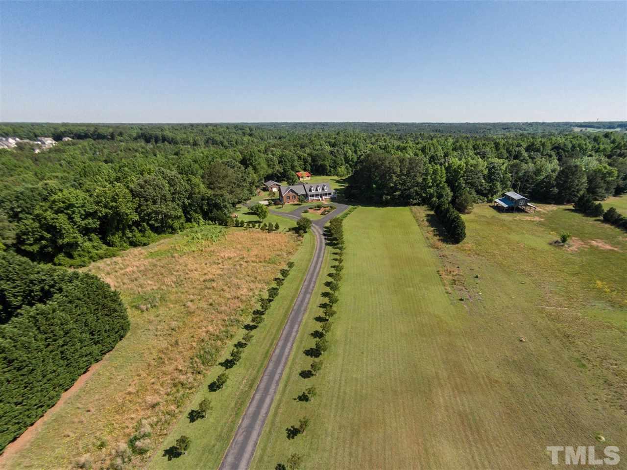3128 Sanders Road Willow Spring, NC 27592 - Photo 21 of 25 a view of a yard and ocean view