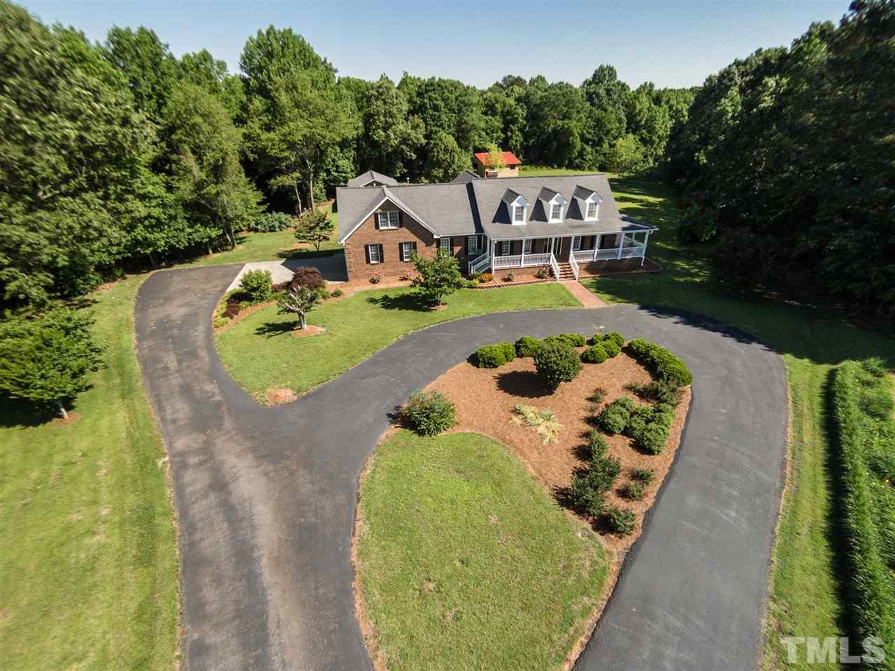 3128 Sanders Road Willow Spring, NC 27592 - Photo 22 of 25 an aerial view of a house with swimming pool and big yard