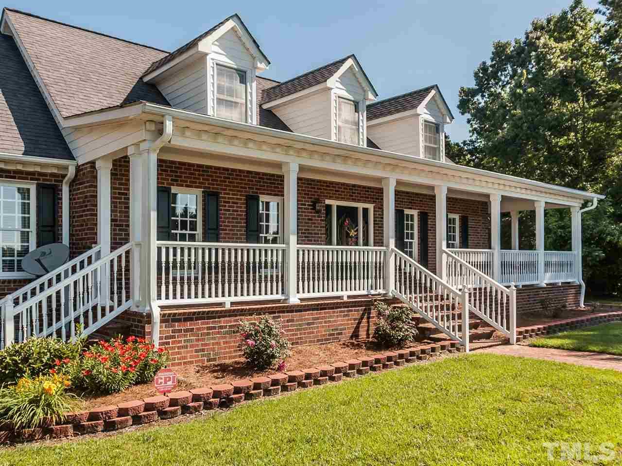 3128 Sanders Road Willow Spring, NC 27592 - Photo 24 of 25 front view of a house with a yard