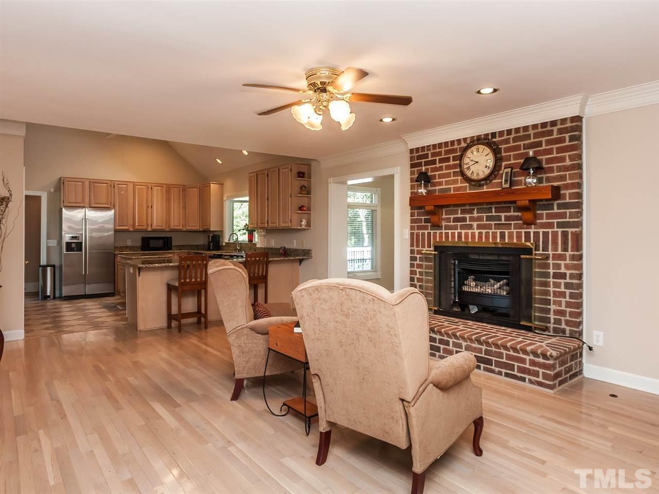 3128 Sanders Road Willow Spring, NC 27592 - Photo 4 of 25 a living room with furniture and a fireplace