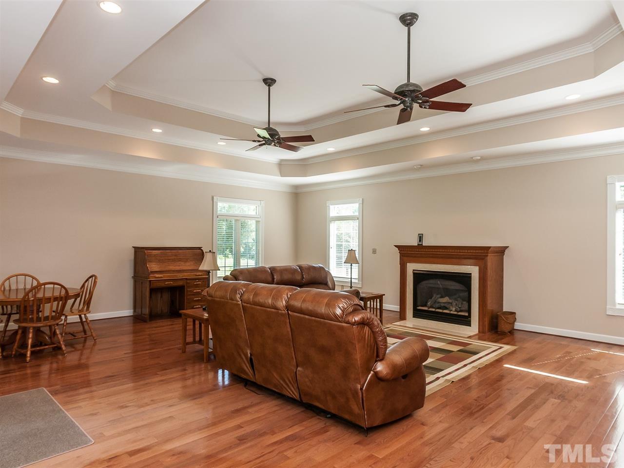 3128 Sanders Road Willow Spring, NC 27592 - Photo 7 of 25 a living room with furniture fireplace and window