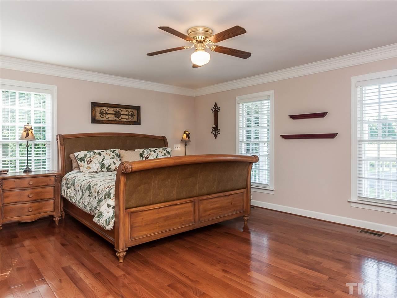 3128 Sanders Road Willow Spring, NC 27592 - Photo 8 of 25 a bedroom with a bed and window
