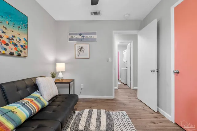 a living room with furniture and a rug