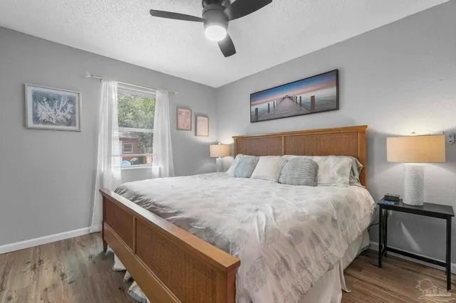 a bedroom with bed and window