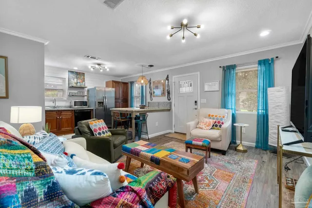 a living room with furniture fireplace and flat screen tv