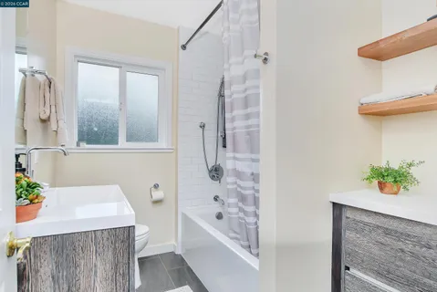 a bathroom with a sink a bathtub and a shower