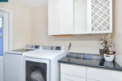 a sink with a washer and dryer