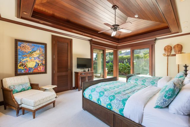 a spacious bathroom with a granite countertop tub mirror and shower