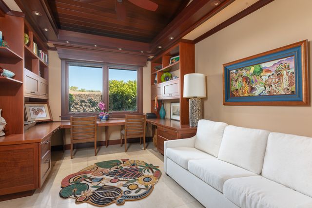 a view of a house with a yard and sitting area