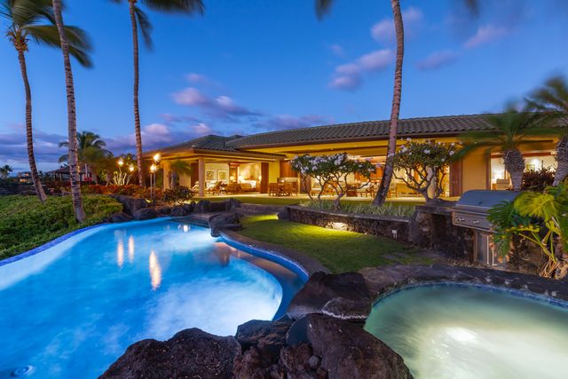 a view of a swimming pool with a patio