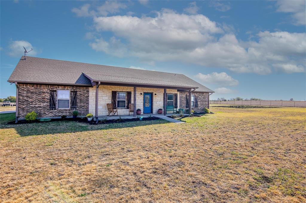 7158 Luella Road Sherman, TX 75090 - Photo 3 of 40 a front view of a house with yard and green space