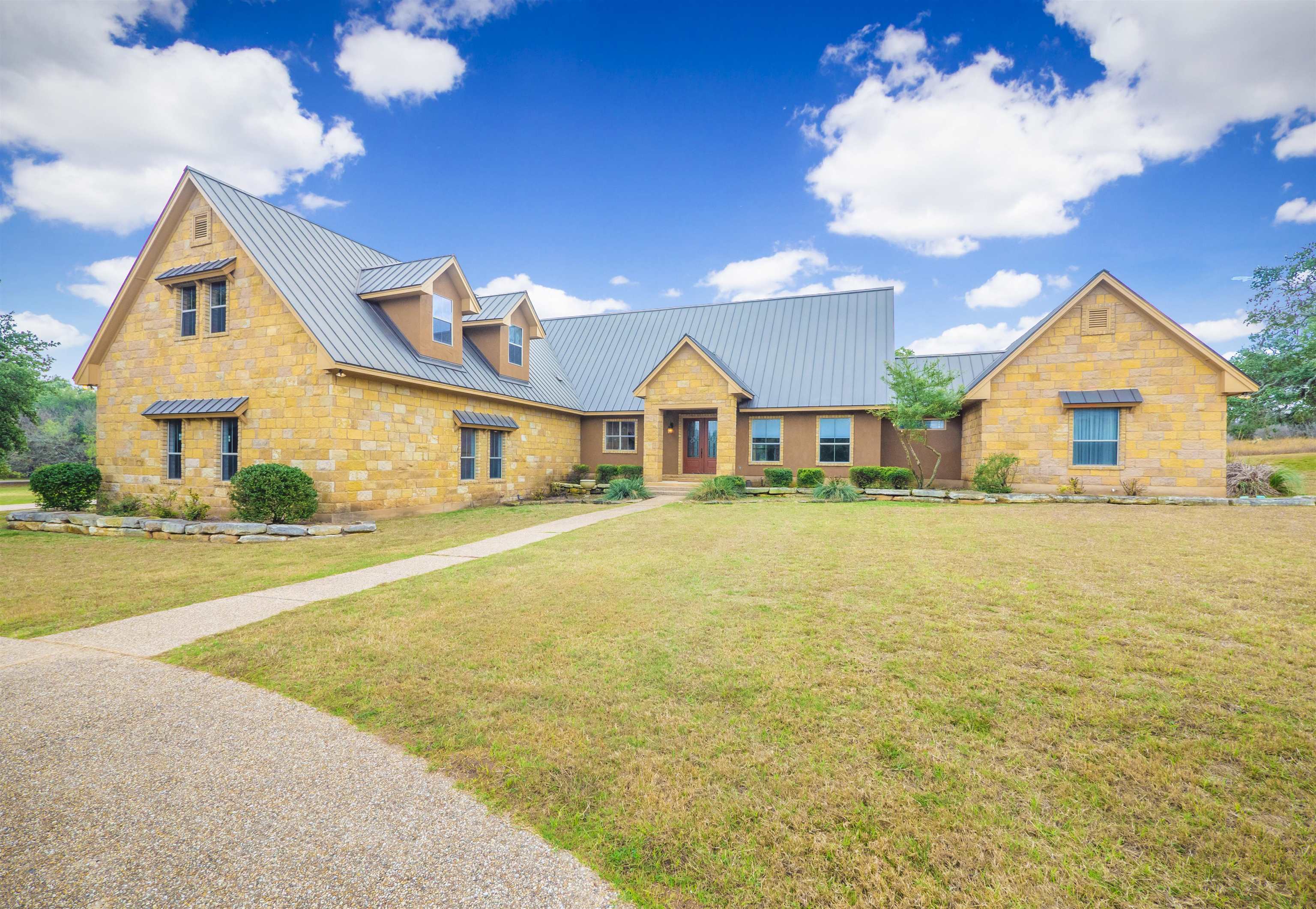 a front view of a house with a swimming pool