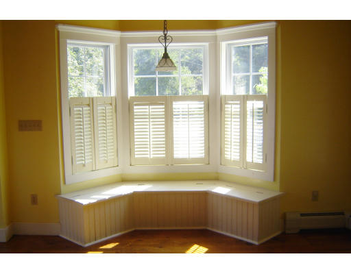 42 Marion Road Middleboro, MA 02346 - Photo 8 of 29 a living room with a large window and a table