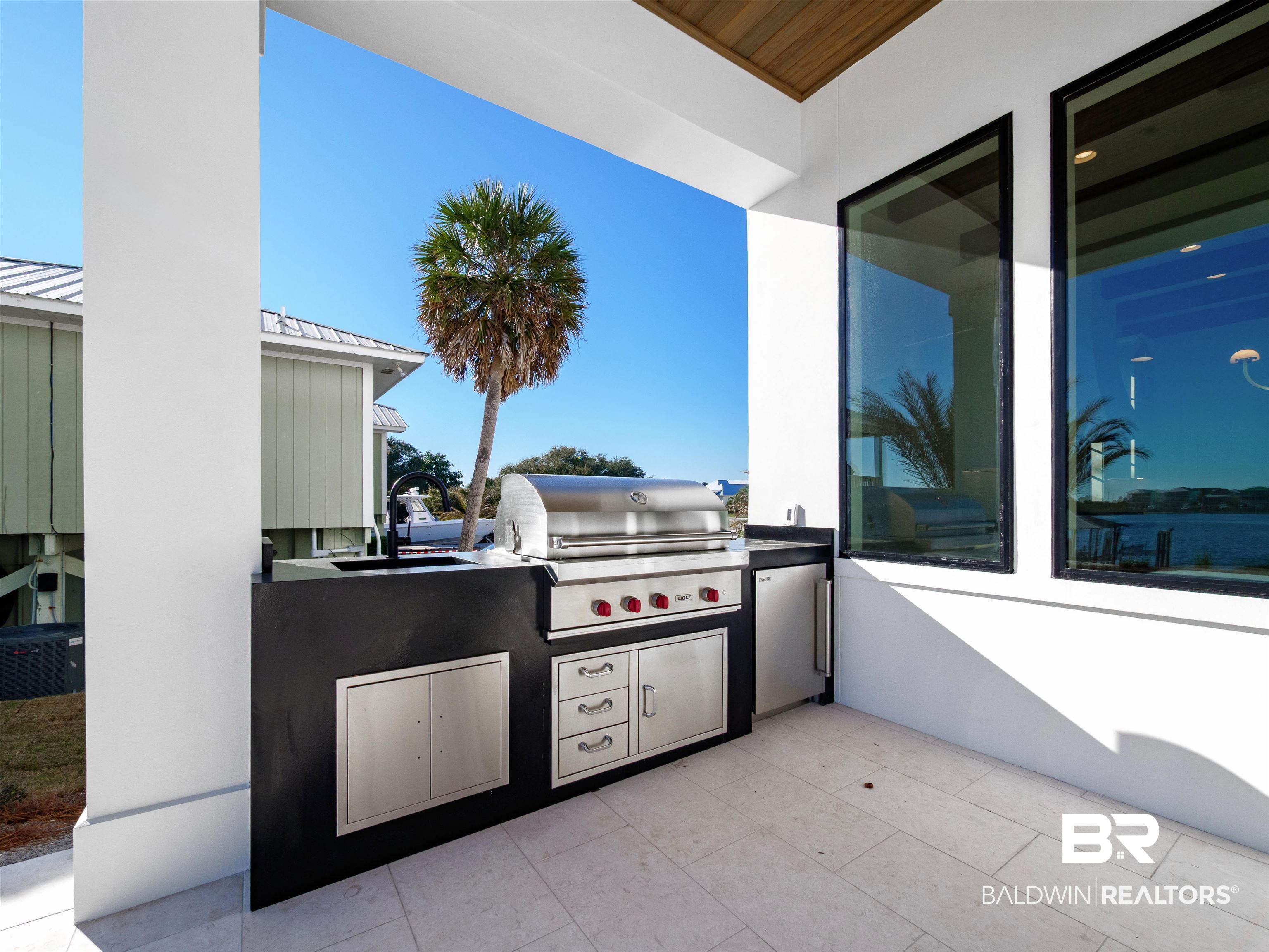 31292 River Road Orange Beach, AL 36561 - Photo 42 of 48 View of patio / terrace featuring an outdoor kitchen, area for grilling, and a sink