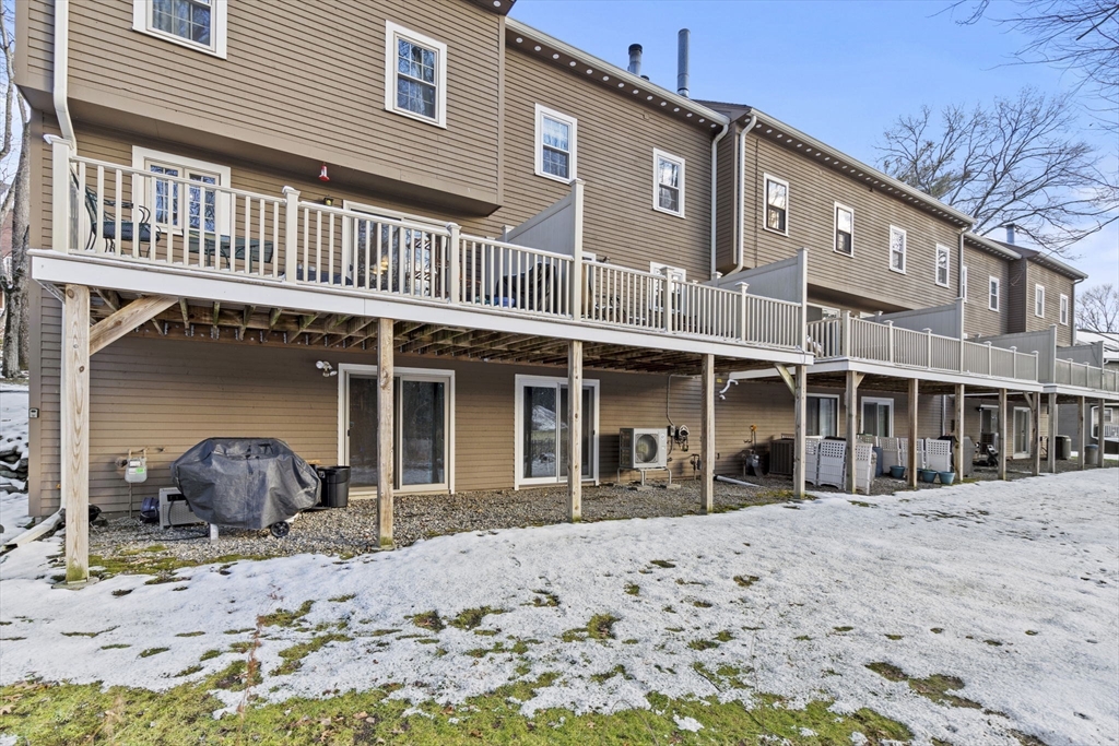 4 Apple Ridge Road, Unit 6 Maynard, MA 01754 - Photo 30 of 40 a front view of a house with a yard
