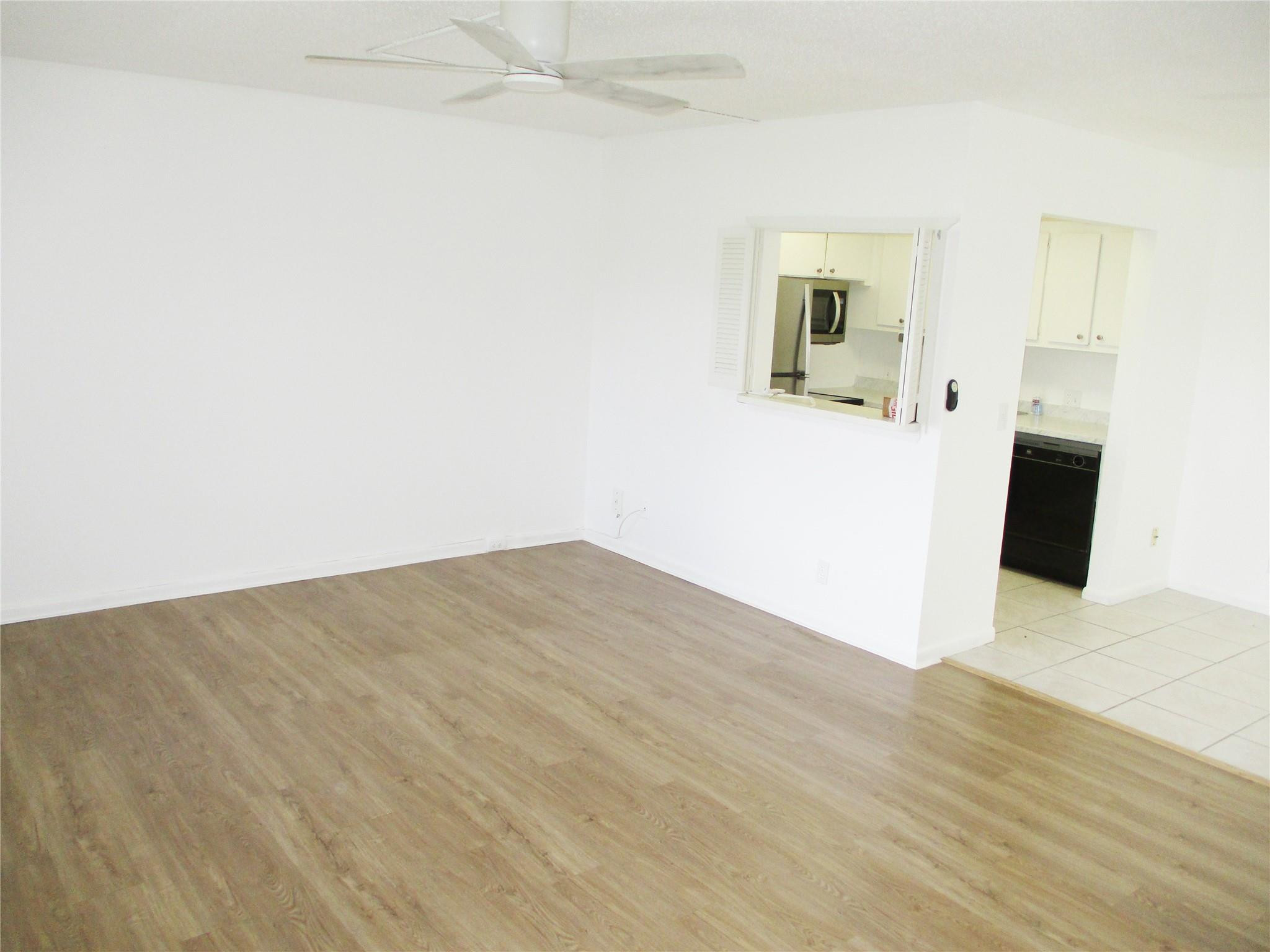 513 Mansfield M, Unit 513 Boca Raton, FL 33434 - Photo 3 of 47 Pass Through from Kitchen to Living Room