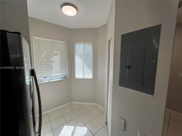 a view of an empty room with windows