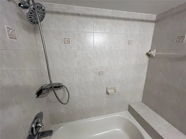 a bathroom with 2 sink and a mirror