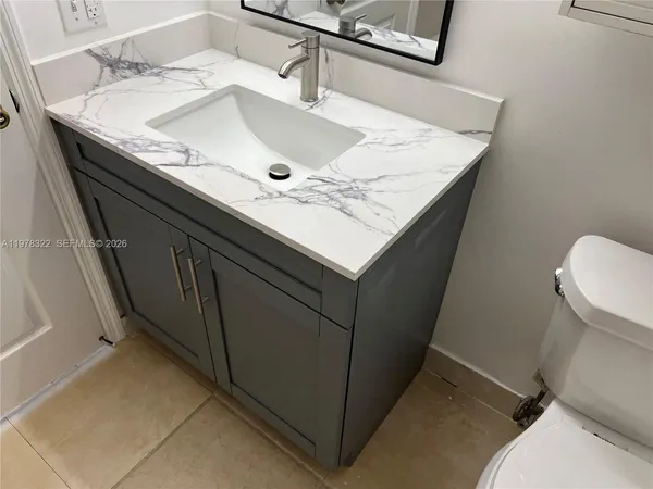 a view of a room with wooden floor and window
