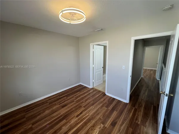 a view of a hallway view with staircase