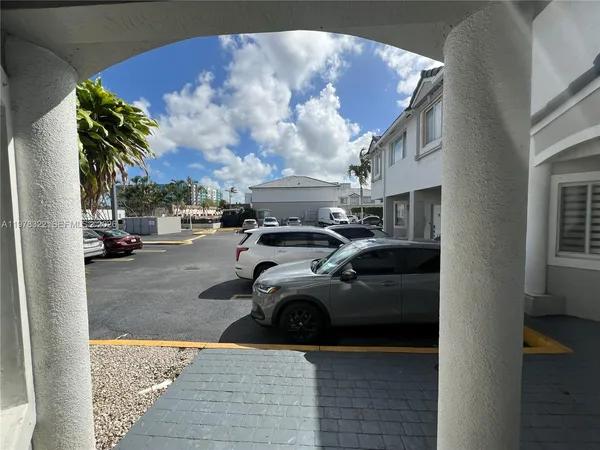 a view of car parked in front of building