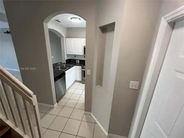 a bathroom with a sink a mirror and a shower