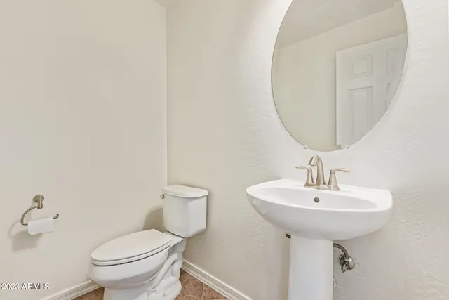 a view of an empty room with a ceiling fan