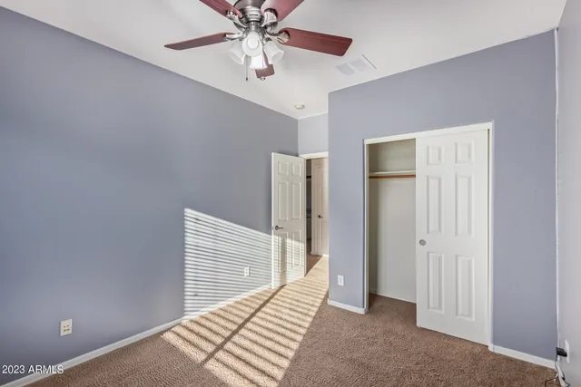 a bathroom with a double vanity sink a mirror and a shower