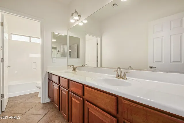 a bathroom with a bathtub and a toilet