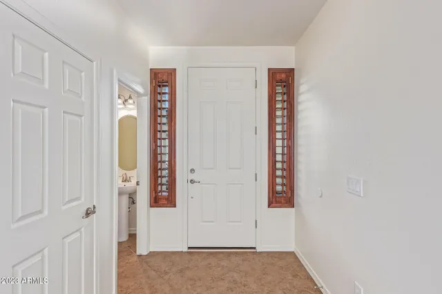 a view of an entryway with wooden floor