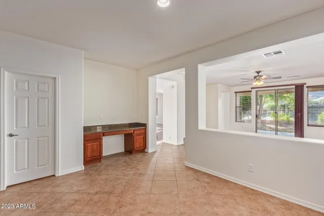 a kitchen with kitchen island granite countertop a sink and a counter top space