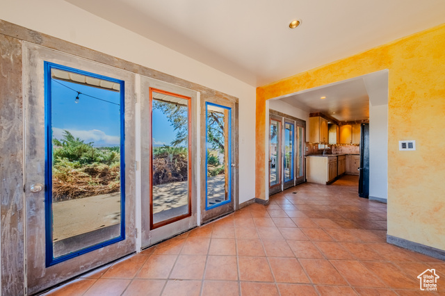 6178 East Zion Road Kanab, UT 84741 - Photo 13 of 48 Doorway to outside with recessed lighting and light tile patterned flooring