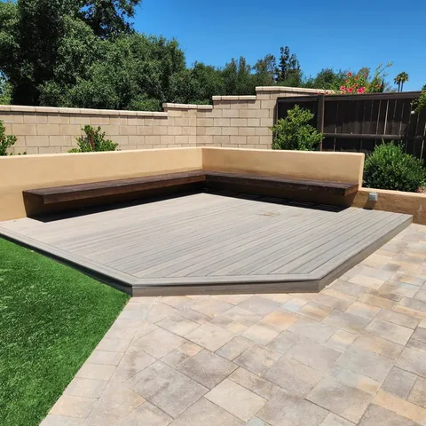 a large kitchen with cabinets wooden floor and a refrigerator