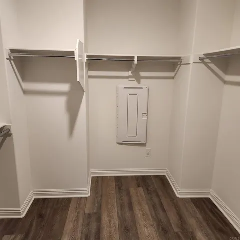 a spacious bathroom with a granite countertop sink and a bathtub