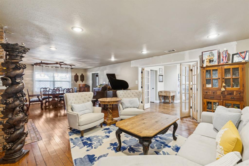 725 Stinson Road Lucas, TX 75002 - Photo 27 of 28 a living room with furniture and a book shelf