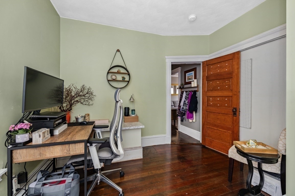 58-60 Cabot Street Everett, MA 02149 - Photo 11 of 39 a view of a workspace with furniture and wooden floor